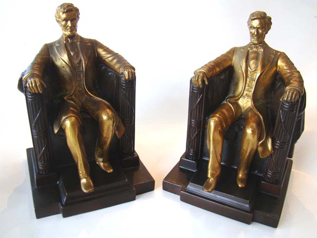 A good pair of two-tone "Lincoln in the chair" bookends by Jennings Brothers circa 1930